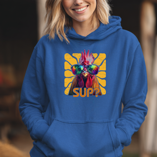 Person wearing a blue hoodie with a colorful graphic of a rooster and 'SUP?' text.
