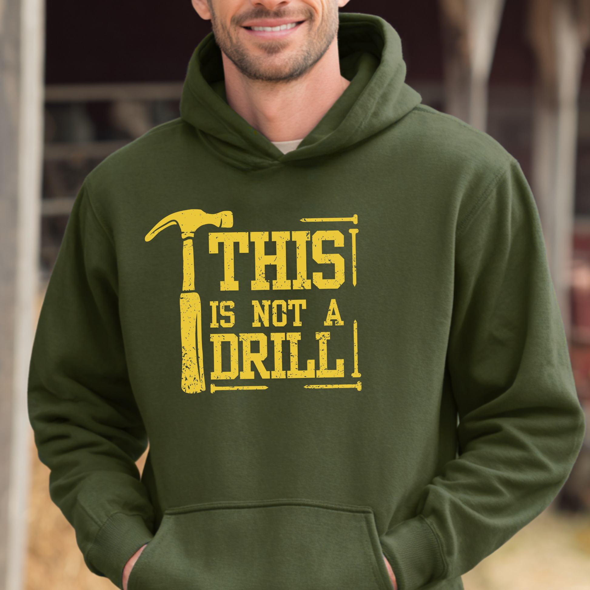 Person wearing a green hoodie with a yellow graphic and text.