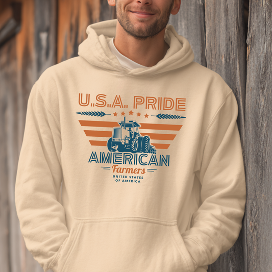 Person wearing a beige hoodie with 'U.S.A. Pride American Farmers' design against a wooden background