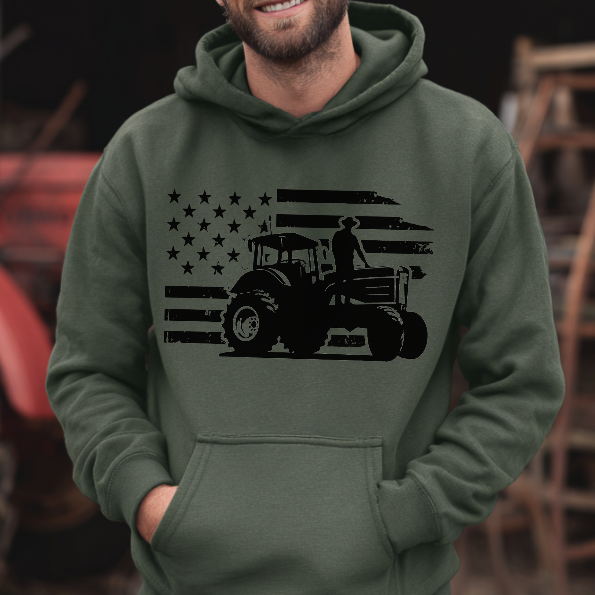 Person wearing a green hoodie with a black tractor and flag design.