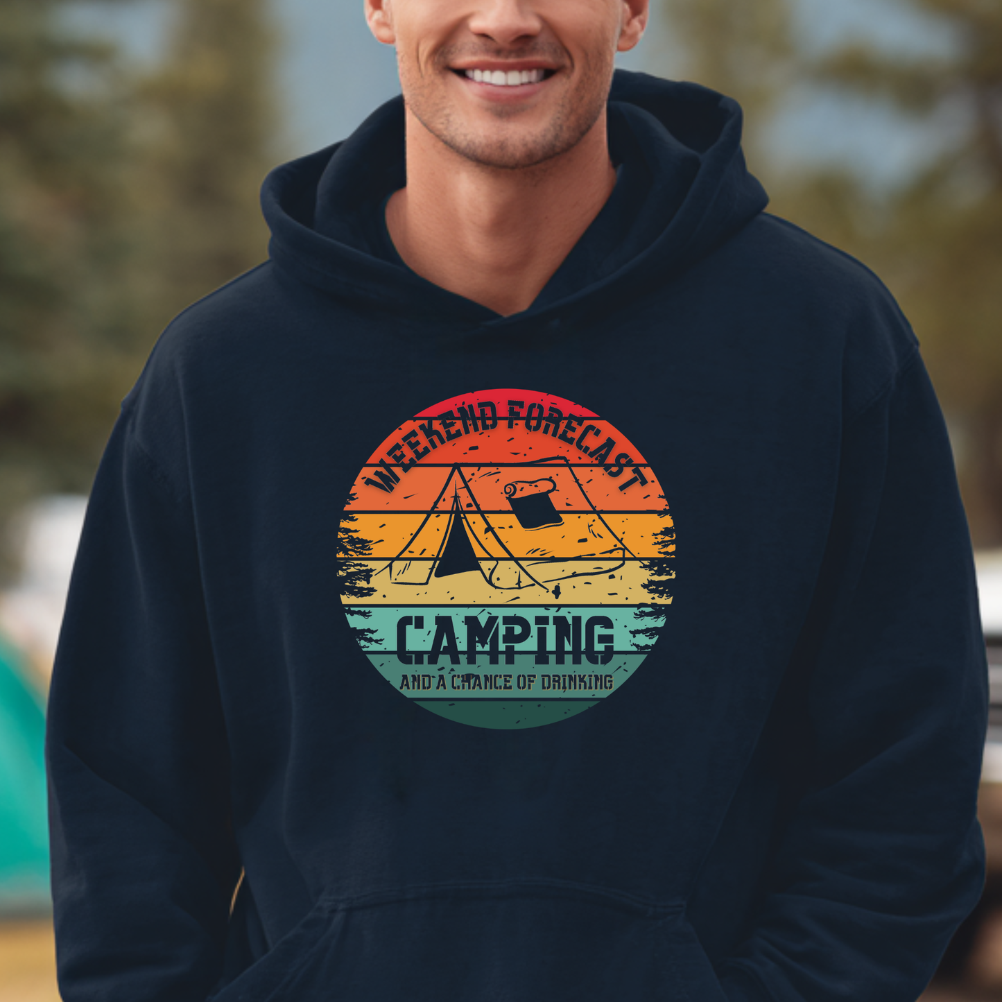 Person wearing a navy hoodie with a camping graphic and text.