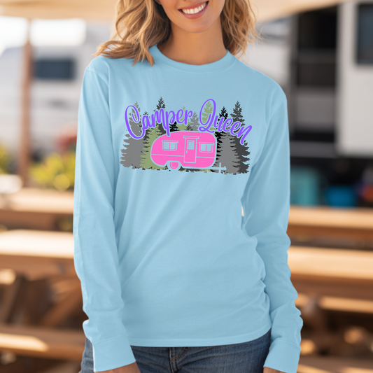 Person wearing a light blue long-sleeve shirt with 'Camper Queen' and an RV graphic.