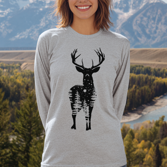 Person wearing a gray long-sleeve shirt with a black deer graphic in front of a scenic background.