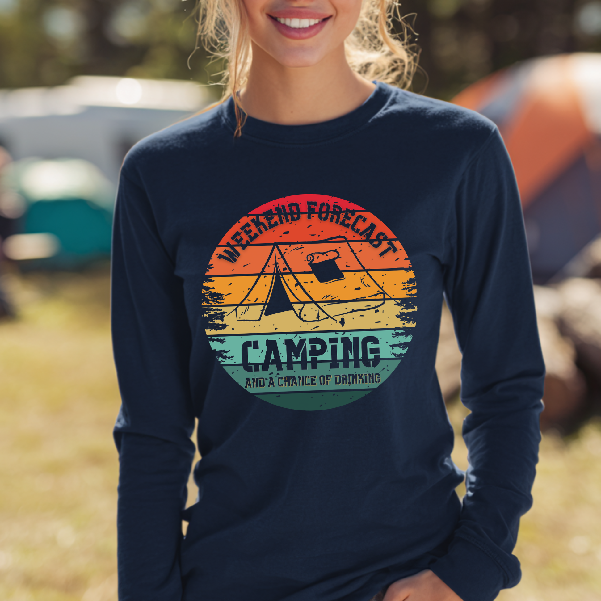 Person wearing a navy blue long-sleeve shirt with a camping graphic and text.