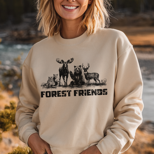 Person wearing a beige sweatshirt with forest-themed design and 'FOREST FRIENDS' text, standing outdoors.