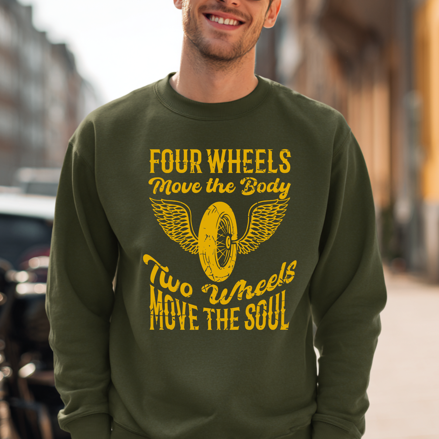 Person wearing a green sweatshirt with yellow text and graphic, standing outdoors.