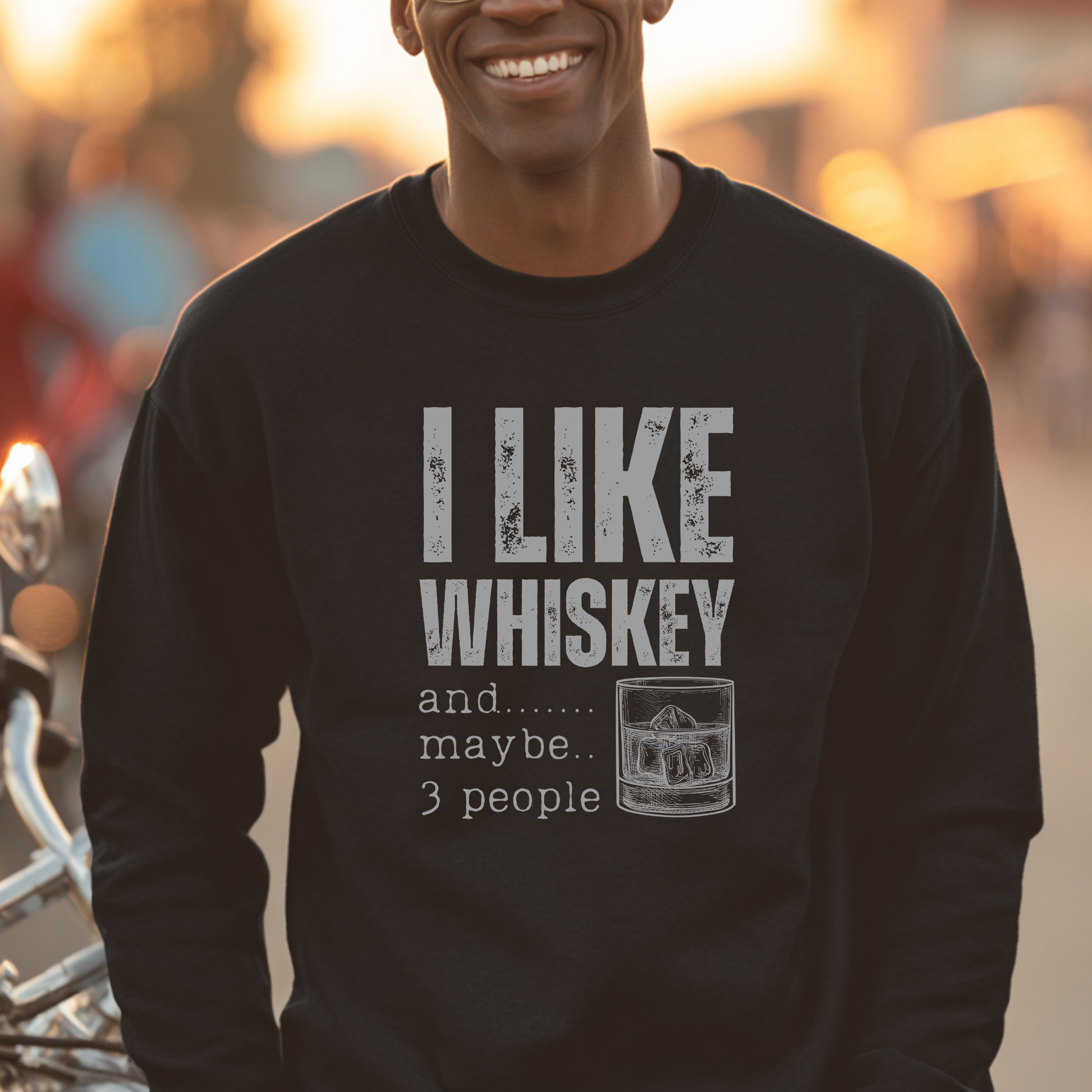 Person wearing a black sweatshirt with 'I Like Whiskey and... maybe... 3 people' text.