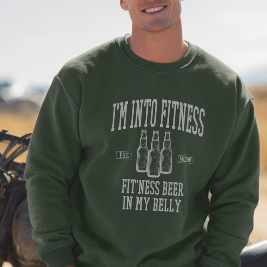 Person wearing a green sweatshirt with humorous fitness and beer text design.