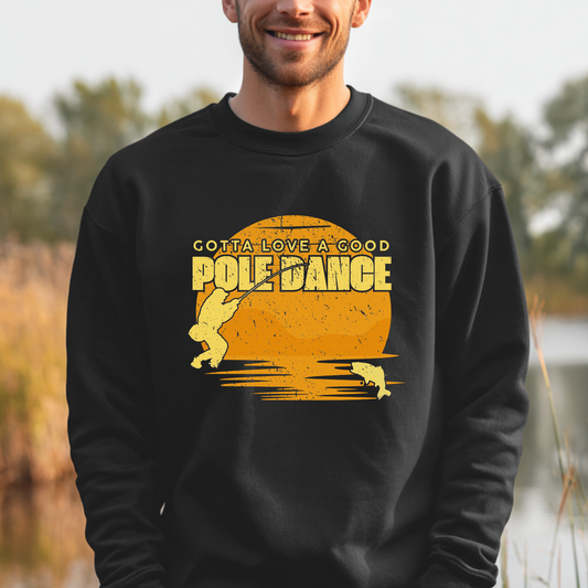 Person wearing a black sweatshirt with yellow graphic and text outdoors