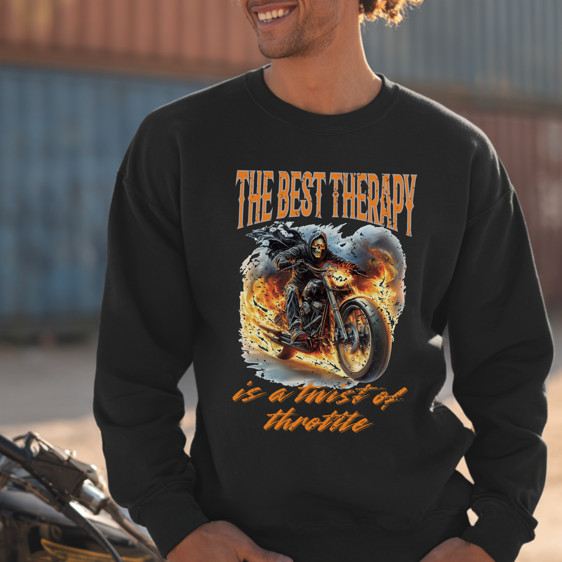 Person wearing a black sweatshirt with a motorcycle graphic and text.