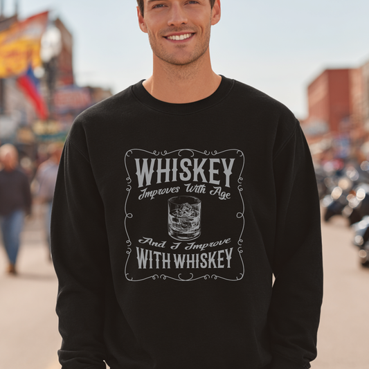 Man wearing a black sweatshirt with 'Whiskey Improves With Age' text and graphic.