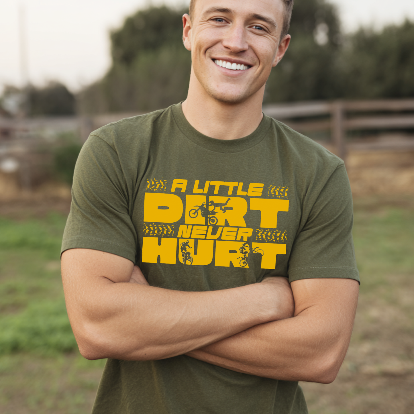 Man wearing a green t-shirt with yellow text standing outdoors.
