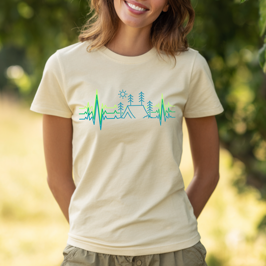 Woman wearing a beige t-shirt with a nature-themed design outdoors