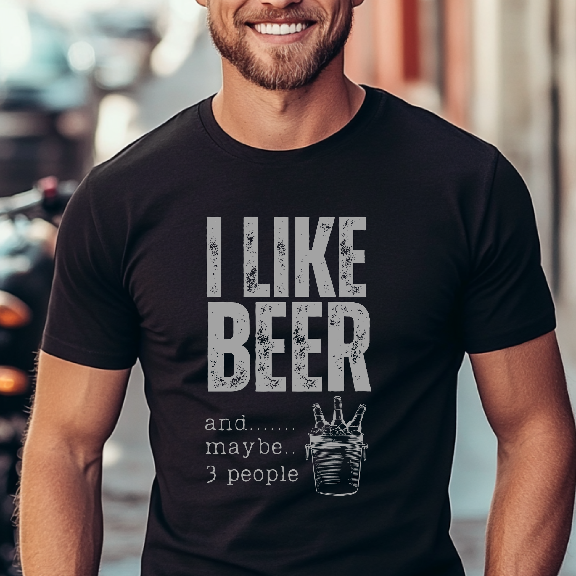 Man wearing a black t-shirt with 'I LIKE BEER and....... maybe... 3 people' text.