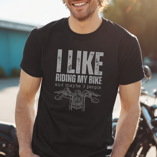 Man wearing a black t-shirt with 'I Like Riding My Bike and maybe 3 people' text and graphic.