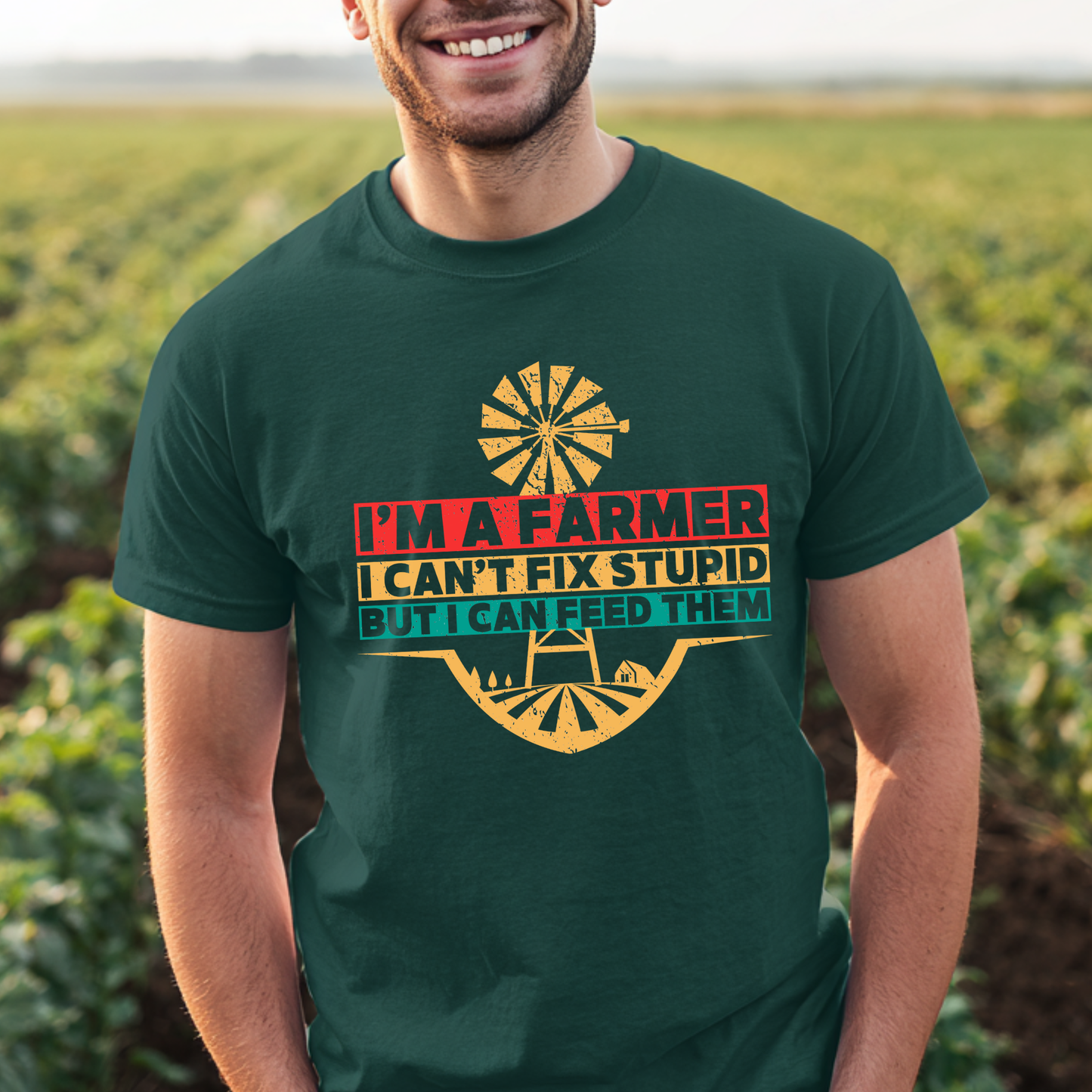 Man wearing a green t-shirt with a humorous farmer quote in a field.