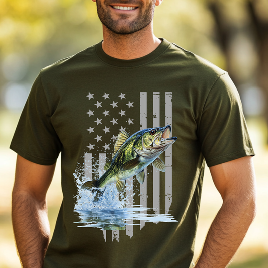 Man wearing a green t-shirt with a fish and American flag design outdoors.