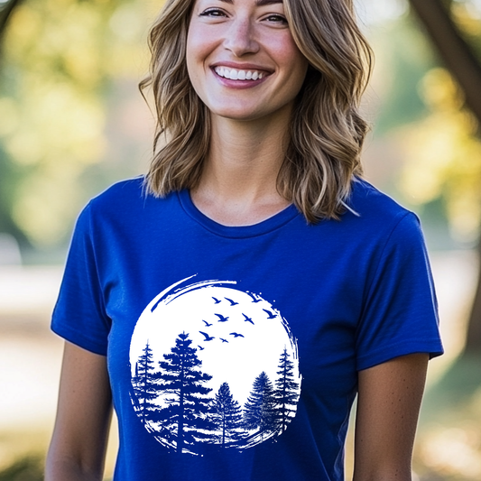 Woman wearing a blue t-shirt with a nature graphic outdoors