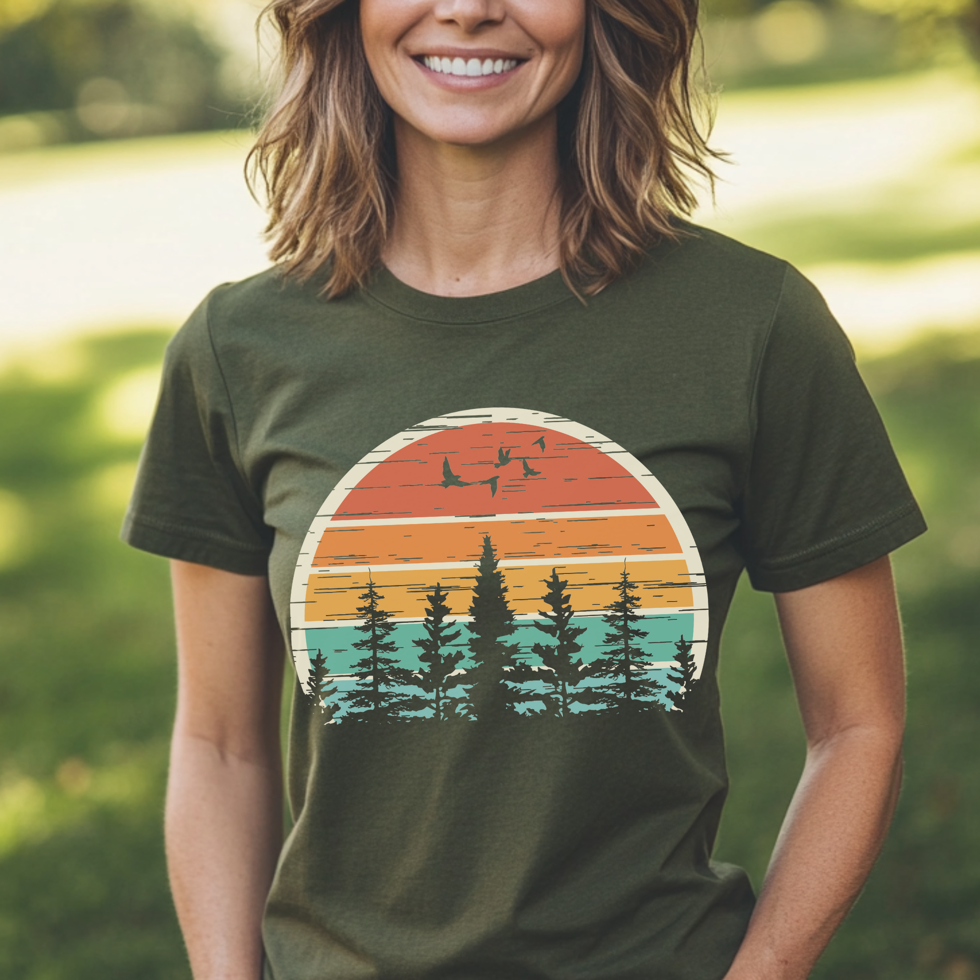 Person wearing a green t-shirt with a nature-themed graphic in an outdoor setting