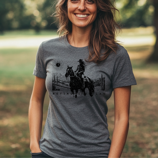 Woman wearing a gray t-shirt with a graphic design outdoors