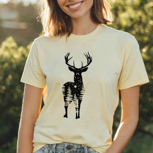 Person wearing a beige t-shirt with a black deer graphic in an outdoor setting