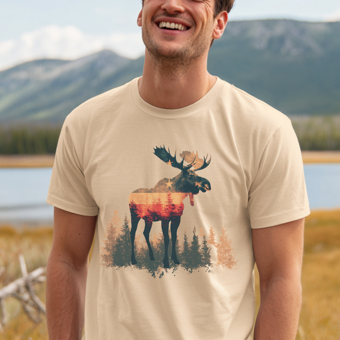 Man wearing a t-shirt with a moose design in a natural setting