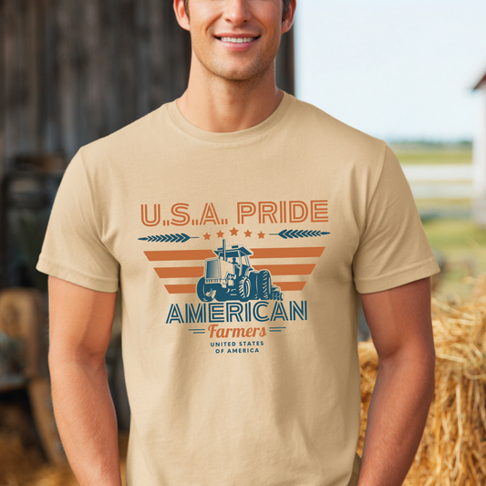 Man wearing a tan t-shirt with 'U.S.A. Pride American Farmers' design outdoors.