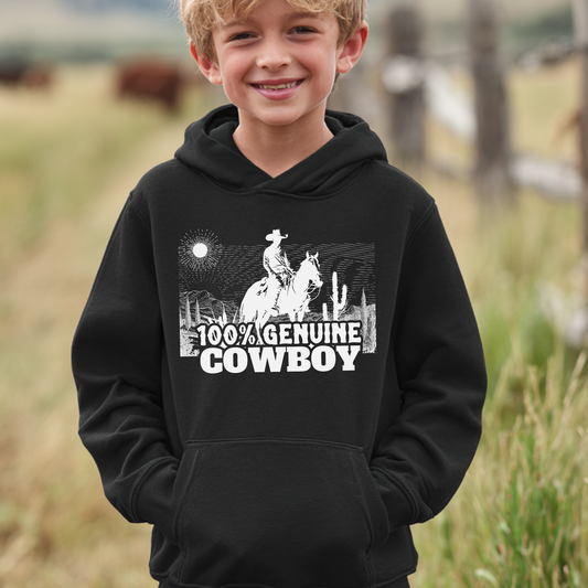 Child wearing a black hoodie with a cowboy graphic and text in a grassy outdoor setting