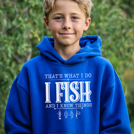 Child wearing a blue hoodie with text 'I Fish and I Know Things' against a green background