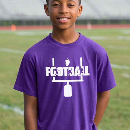 Child wearing a purple t-shirt with 'FOOTBALL' design on a sports field background