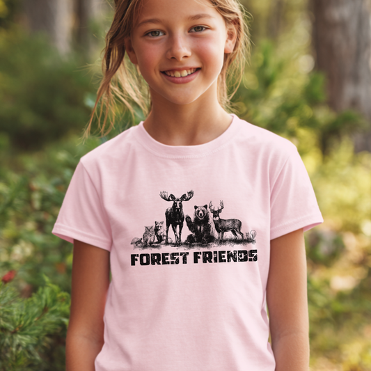Young girl wearing a pink t-shirt with forest-themed graphics and 'FOREST FRIENDS' text in a forest setting.