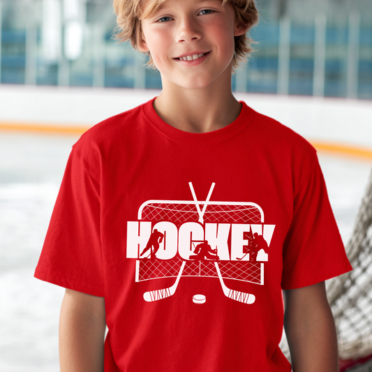 Child wearing a red t-shirt with a white hockey graphic on an ice rink background